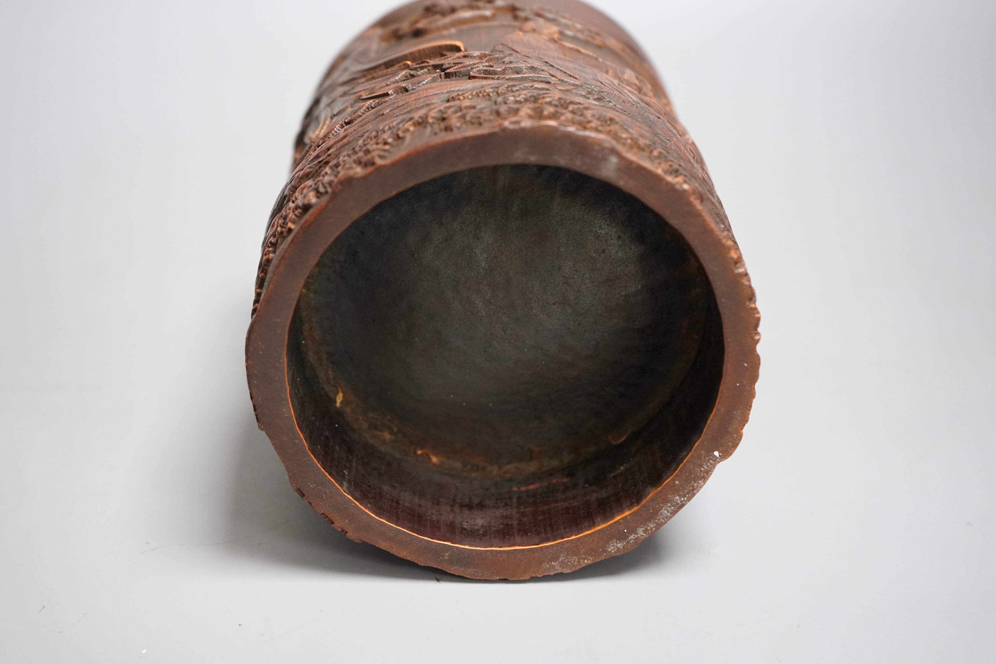 A Chinese 'immortals' carved bamboo brush pot, 16cm